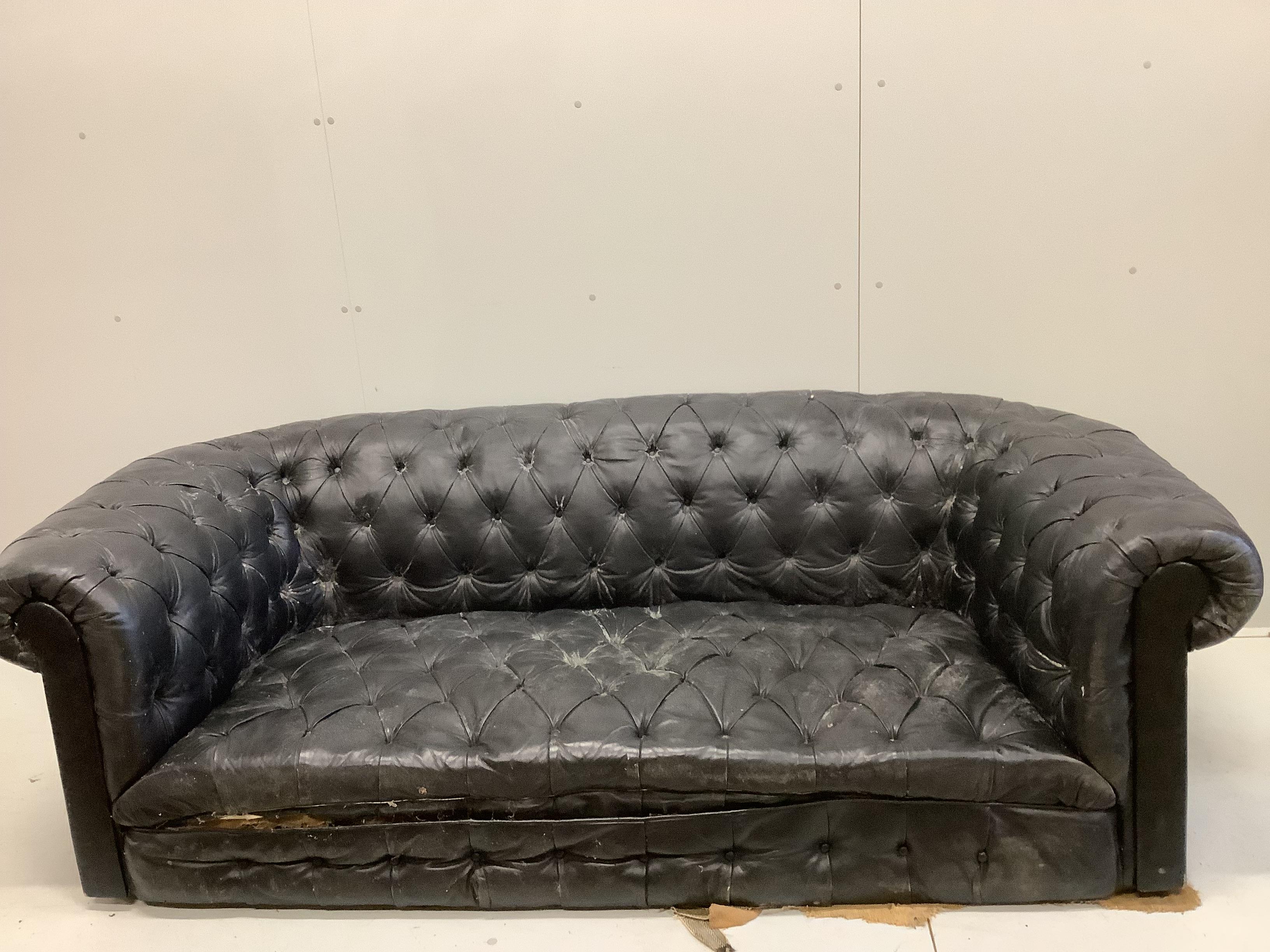 A Victorian and later buttonback leather Chesterfield settee, feet detached and in need of restoration, width 204cm, depth 99cm, height 66cm